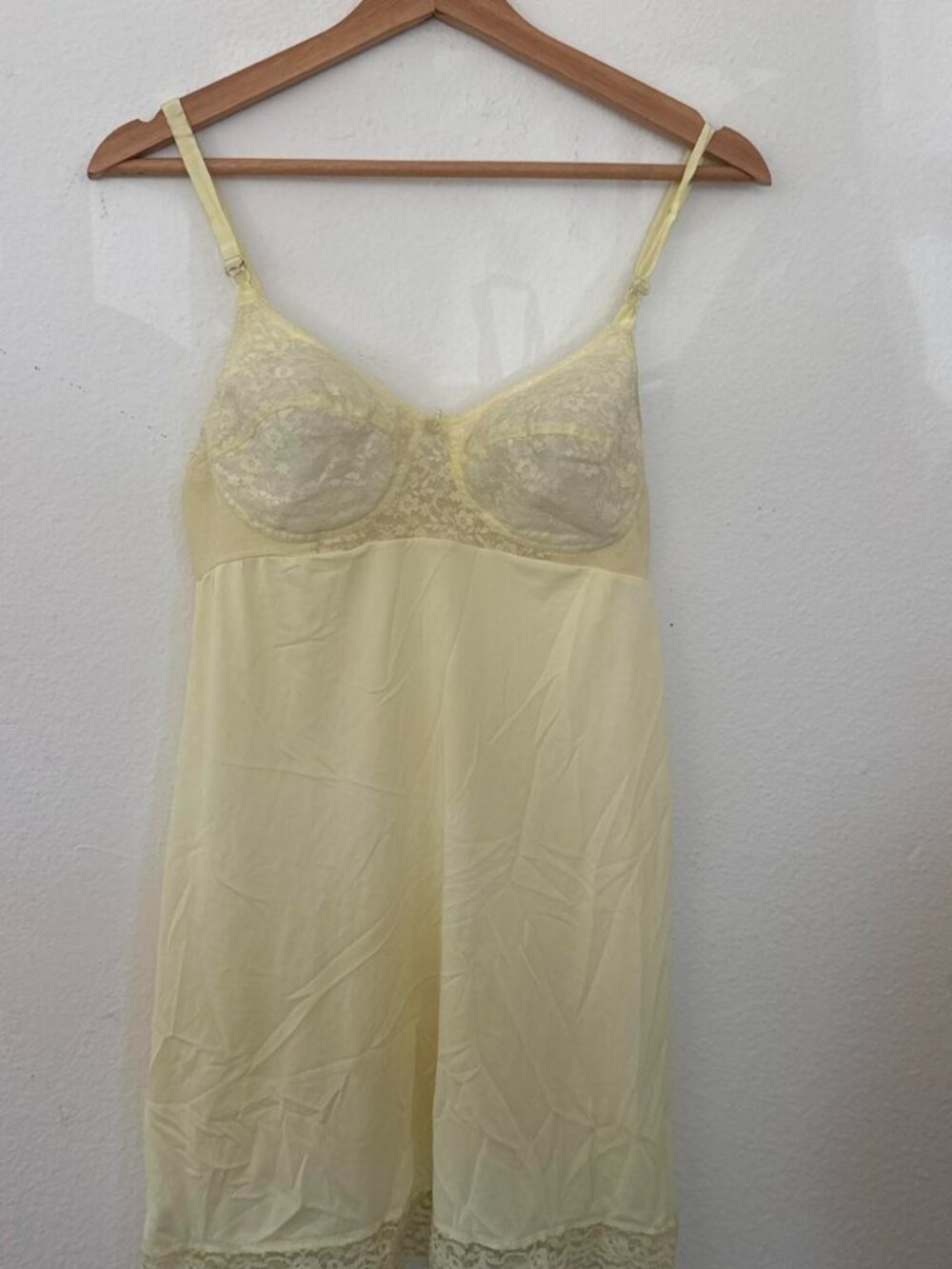 Yellow lace slip dress with lace trim at hem